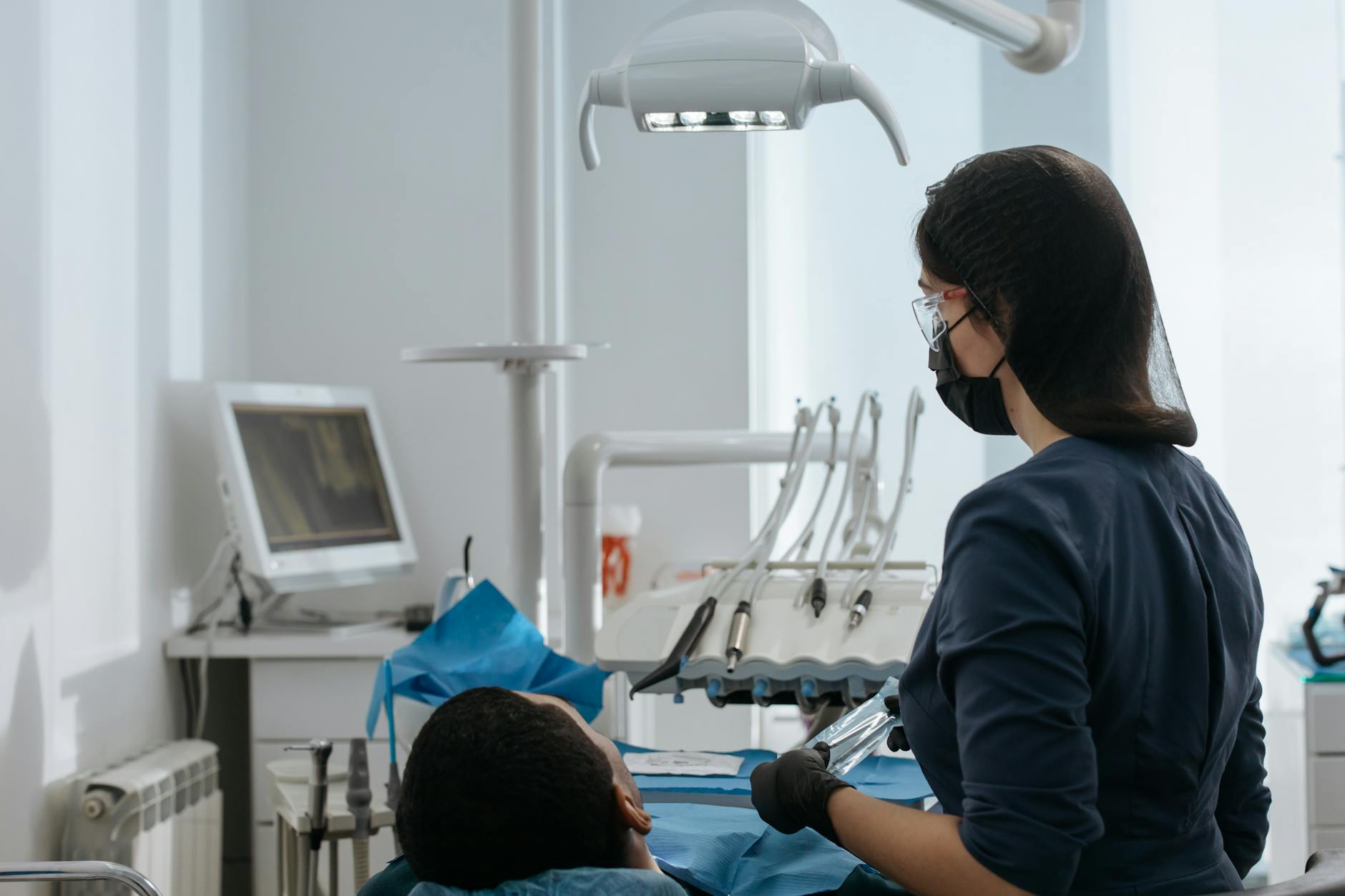 Dentist providing treatment in a modern dental clinic