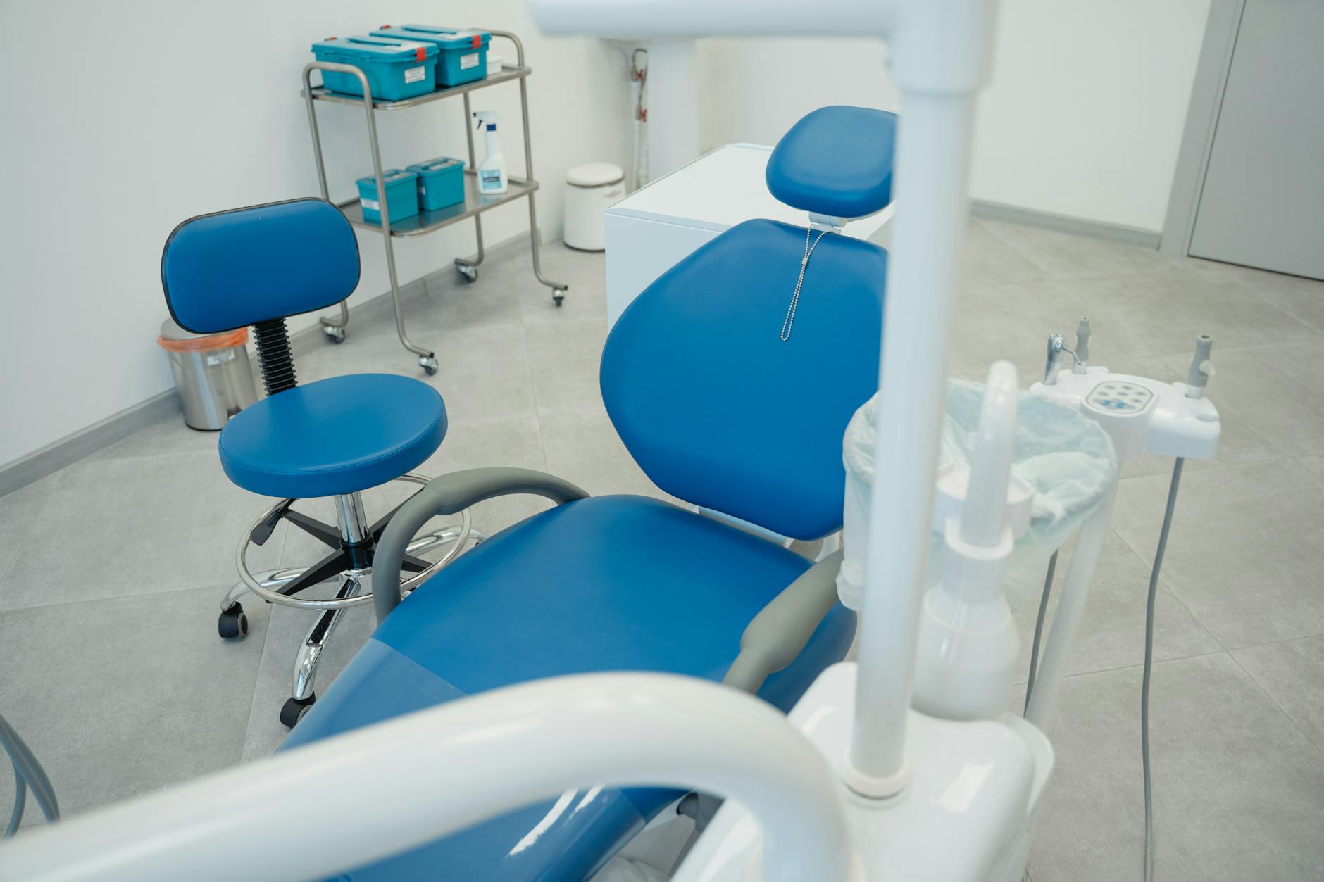 Modern dental chair and equipment in a clean treatment room